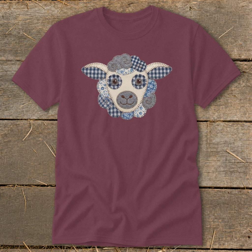 Burgundy t-shirt with a blue and white patchwork sheep face graphic.