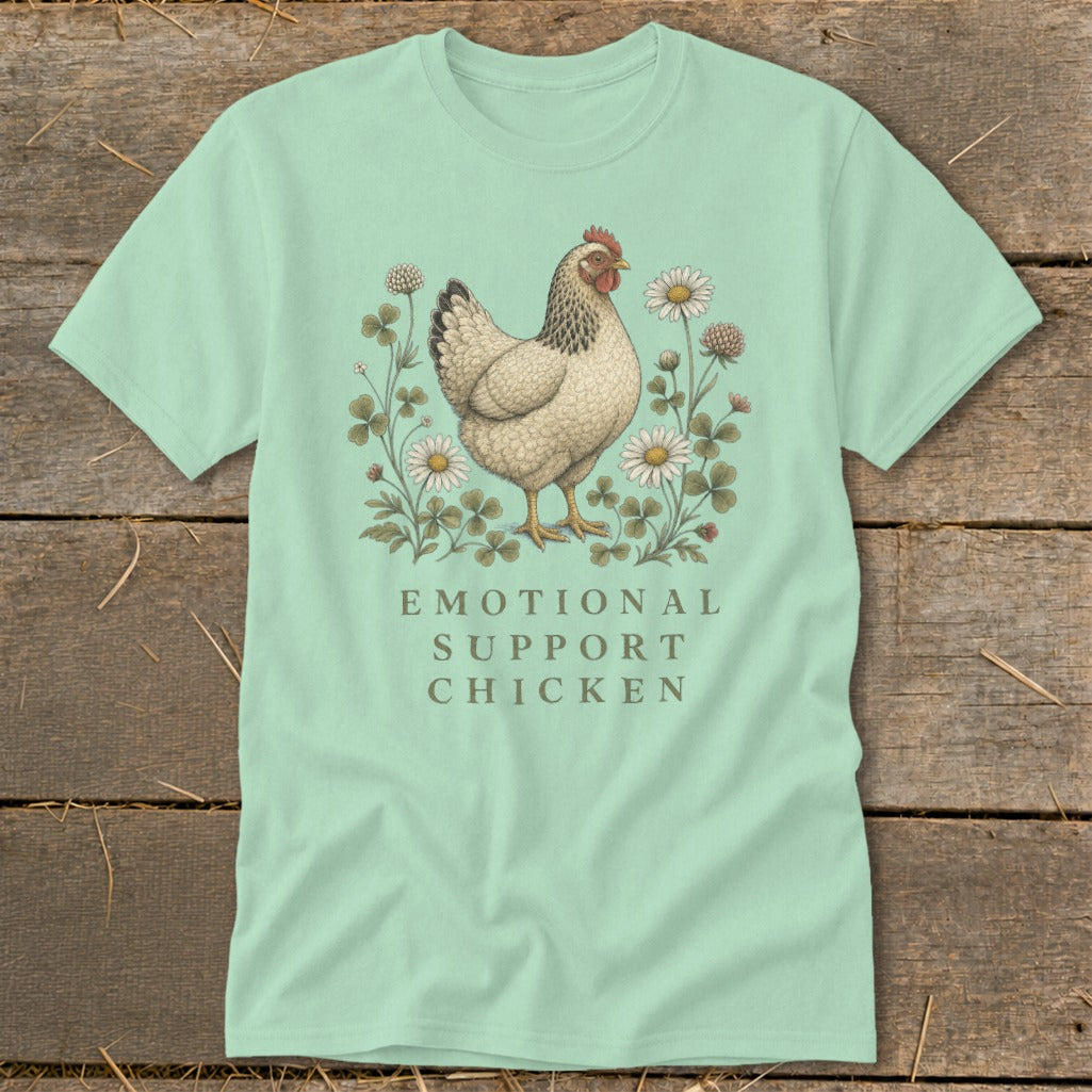 Light teal t-shirt with an illustration of a chicken surrounded by flowers and text.