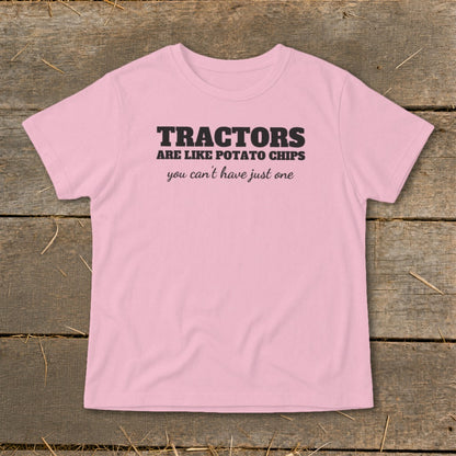 Pink t-shirt with black text "TRACTORS ARE LIKE POTATO CHIPS you can't have just one".