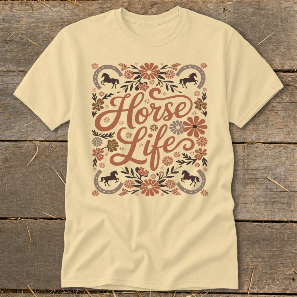 Light yellow t-shirt with floral "Horse Life" graphic and horse silhouettes.