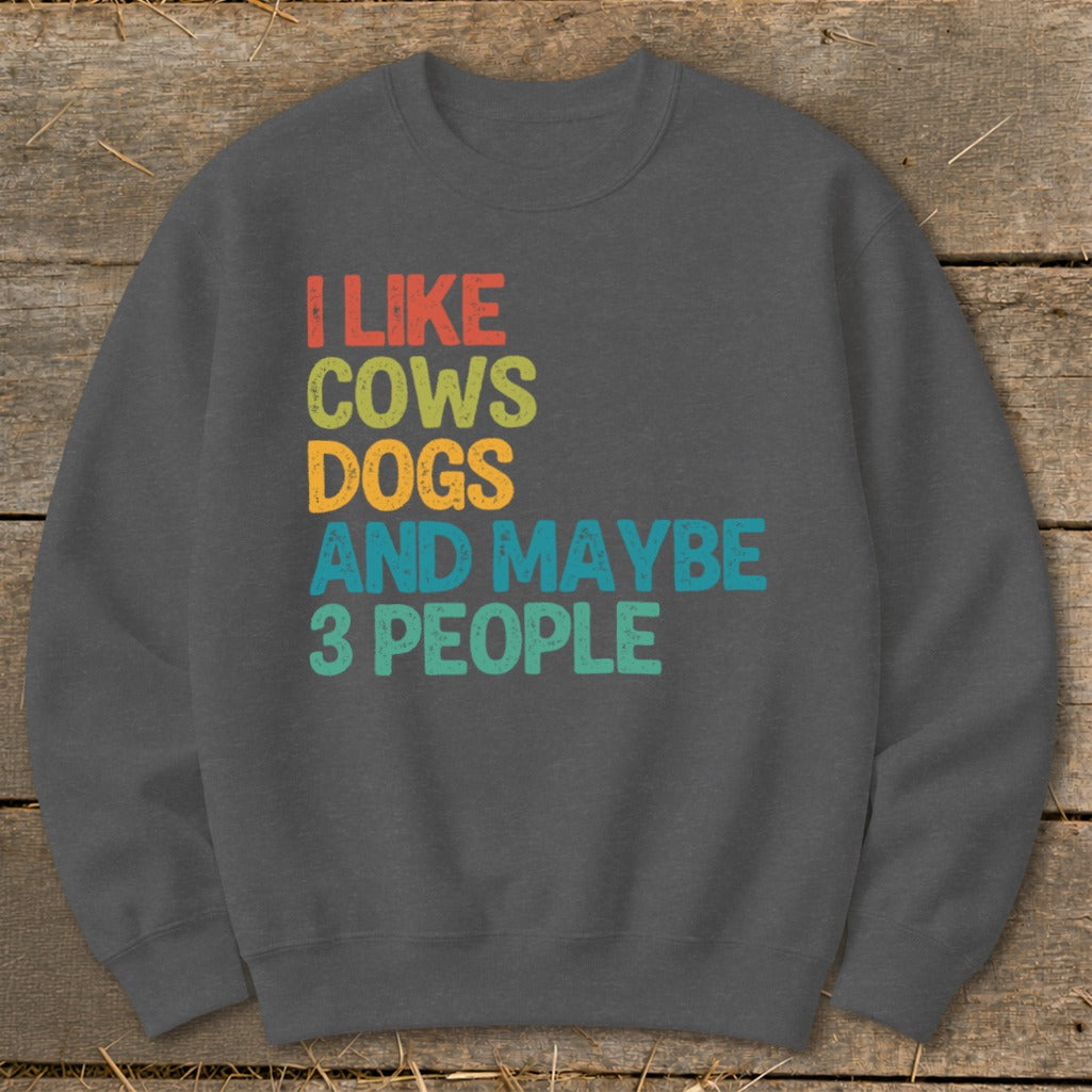 Dark grey sweatshirt with text "I like cows, dogs, and maybe 3 people."