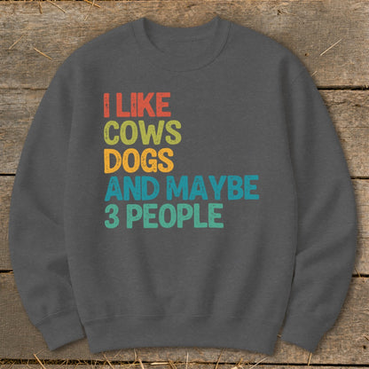 Dark grey sweatshirt with text "I like cows, dogs, and maybe 3 people."