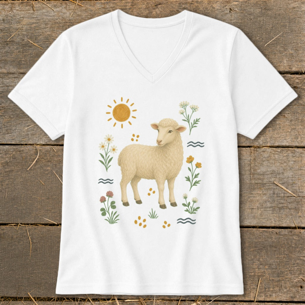 White v-neck shirt with a cream-colored sheep illustration surrounded by flowers, sun, and waves.