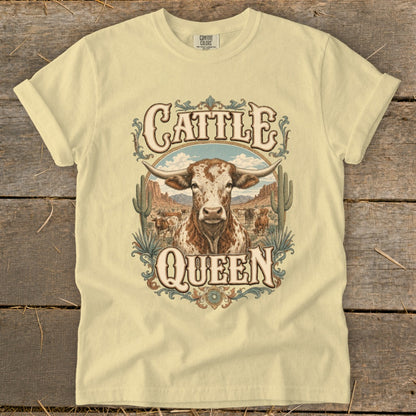 Light yellow t-shirt with a rustic graphic featuring a longhorn and the words "Cattle Queen".
