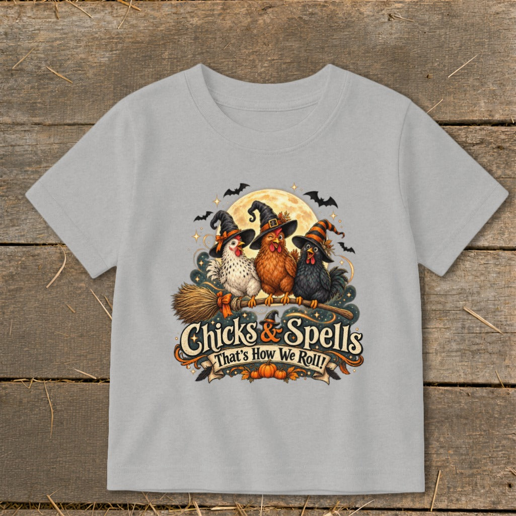 Three witches chickens on broomstick with text "Chicks & Spells That's How We Roll!"