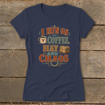 Navy t-shirt with "I run on coffee, hay and chaos" text, coffee cup, hay bale, and horseshoe graphic.