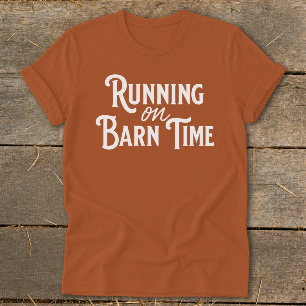 Orange t-shirt with white text reading "Running on Barn Time".