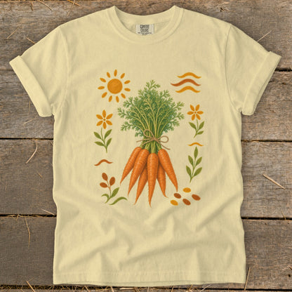 Light yellow t-shirt featuring a bouquet of carrots with surrounding sun, flowers, and wavy lines.