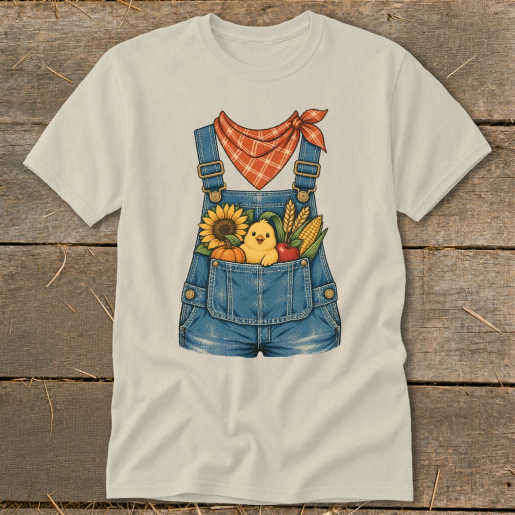 T-shirt with denim overalls graphic featuring a chick and fall harvest items.