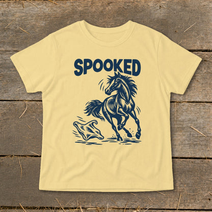 Light yellow t-shirt with a navy blue graphic of a horse running from a ghost.