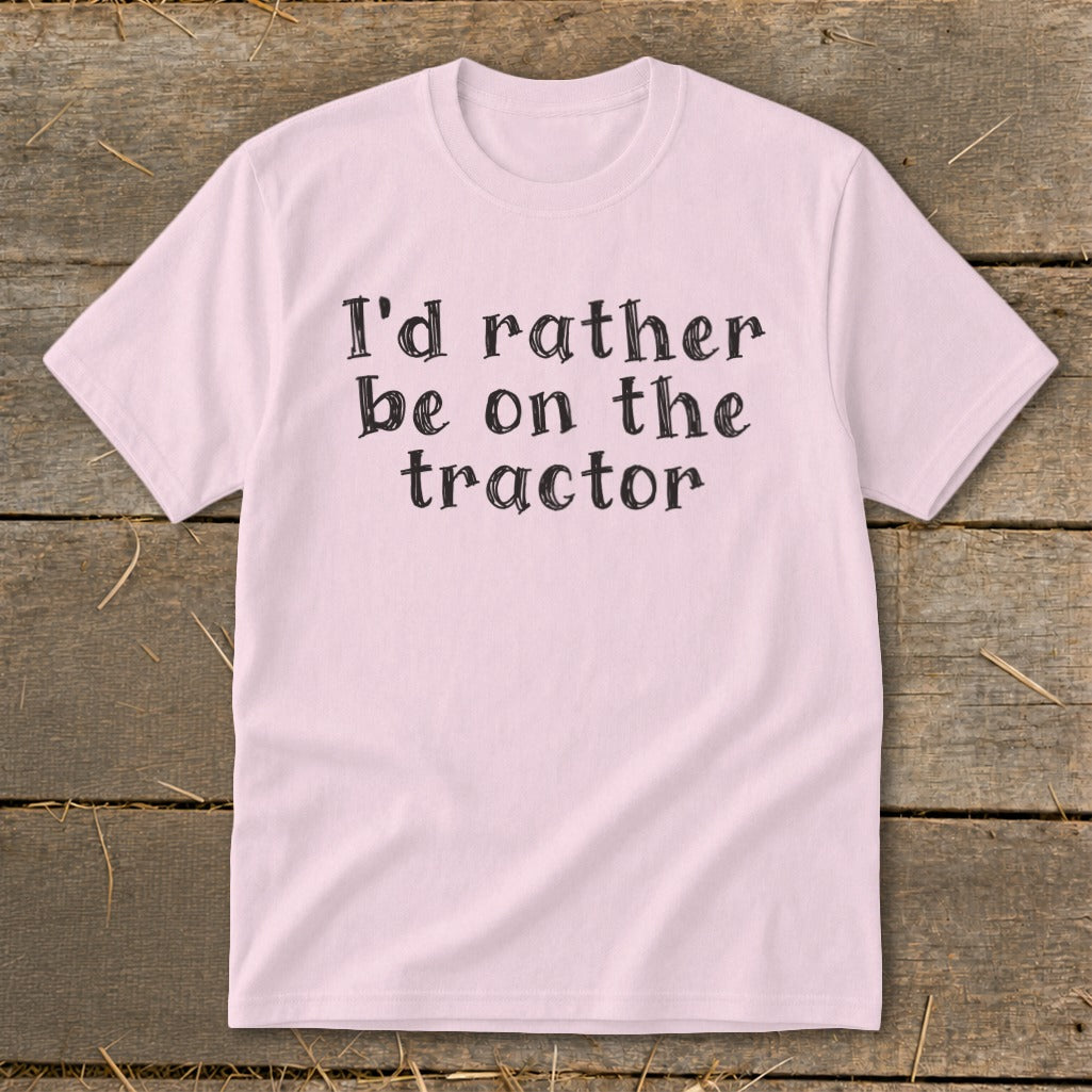Pink t-shirt with black text that reads "I'd rather be on the tractor".