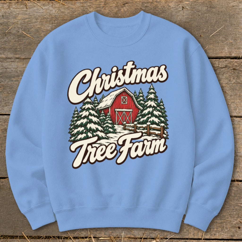 Light blue sweatshirt with Christmas Tree Farm barn and tree graphic.