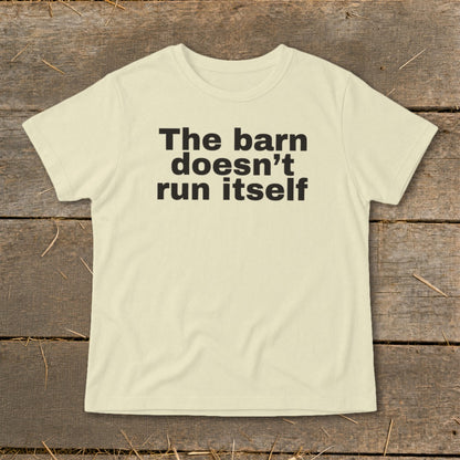 Cream t-shirt with black text that reads "The barn doesn't run itself."