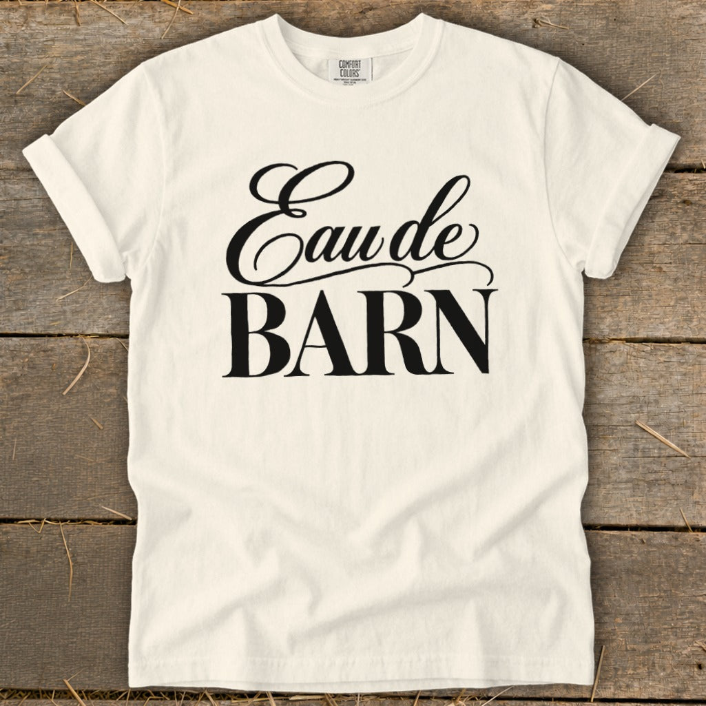 Cream t-shirt with black text "Eau de BARN" and Comfort Colors label.
