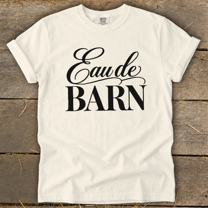 Cream t-shirt with black text "Eau de BARN" and Comfort Colors label.