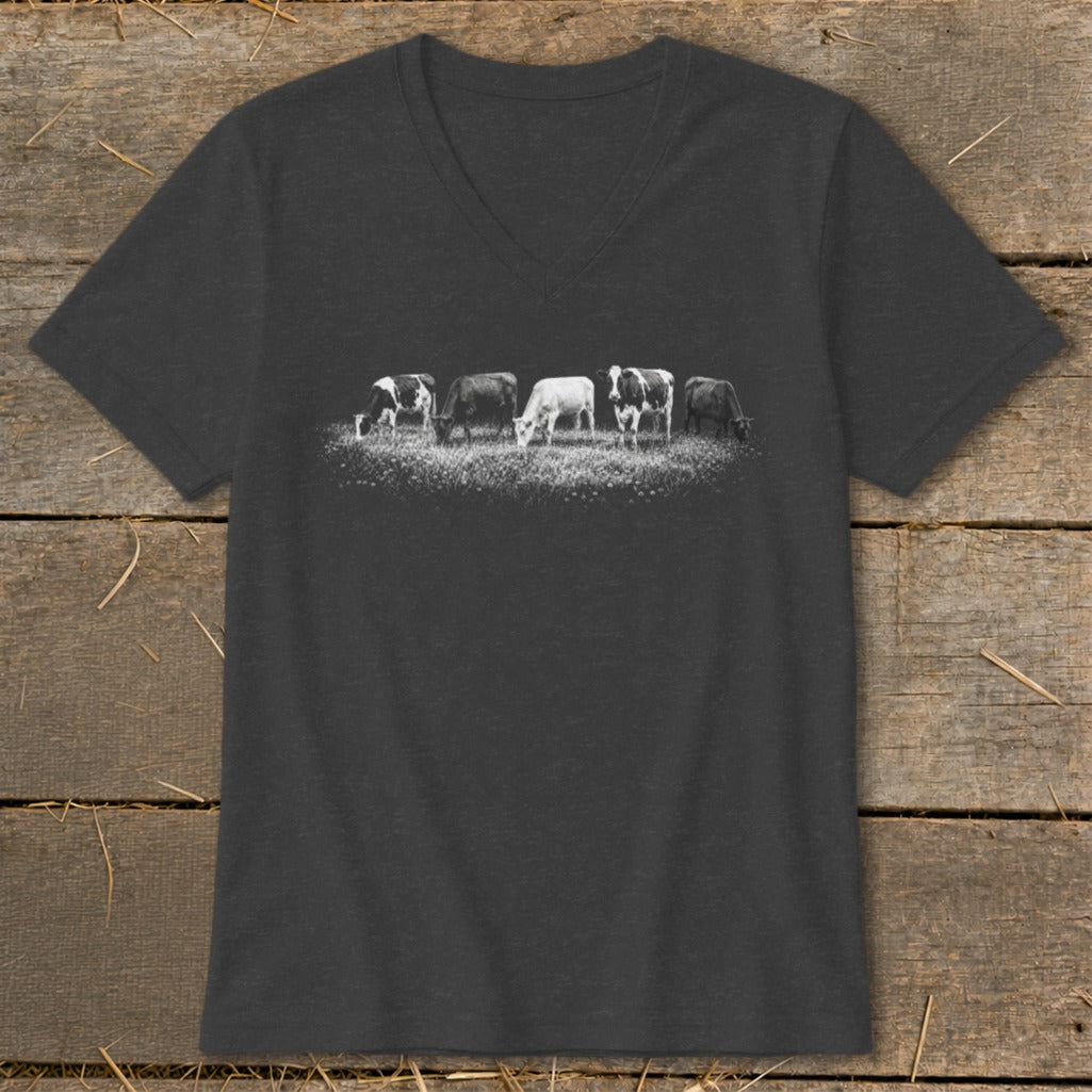 T-shirt with a black and white graphic of five cows grazing in a field.