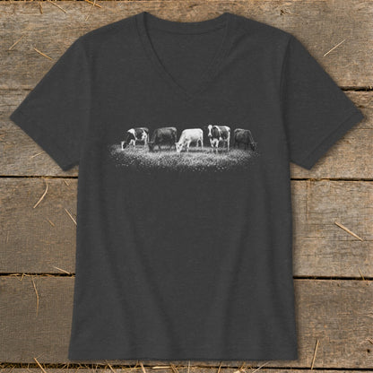 T-shirt with a black and white graphic of five cows grazing in a field.