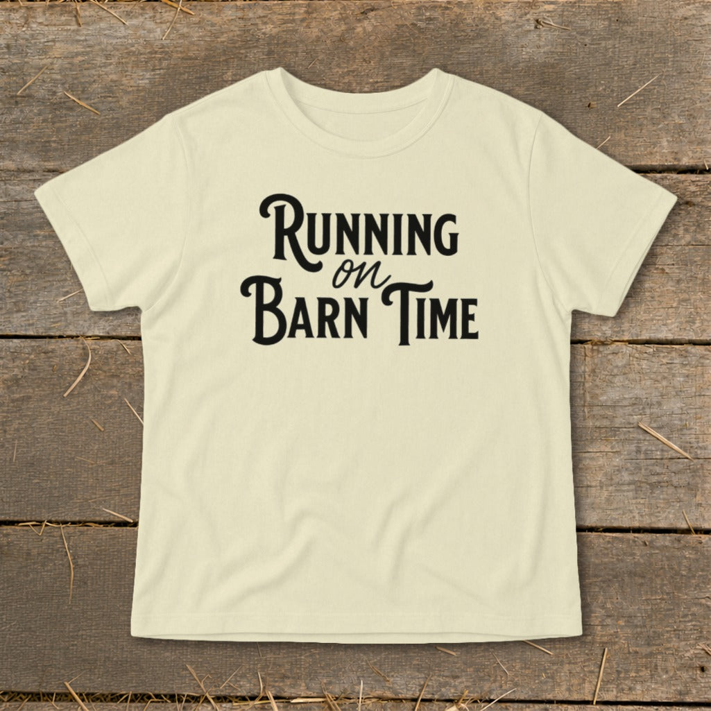 Light yellow t-shirt with "Running on Barn Time" text in black script font.