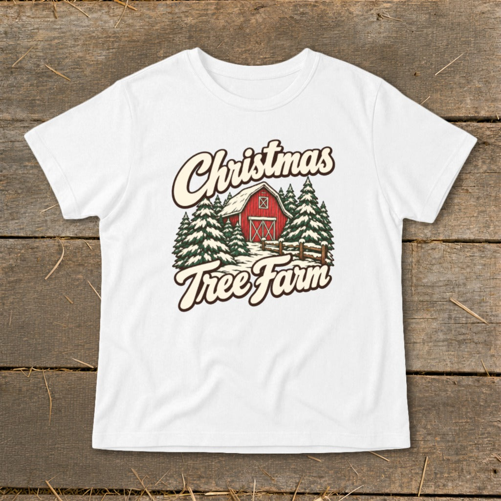 White t-shirt with "Christmas Tree Farm" text over a barn and pine trees.