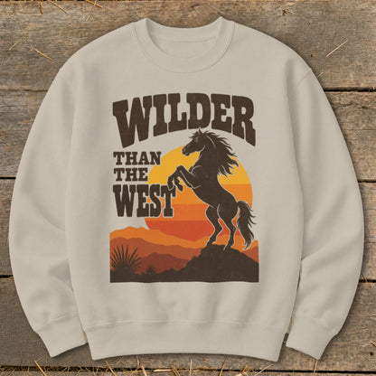 Crewneck sweatshirt with "Wilder Than The West" graphic featuring a rearing horse at sunset.