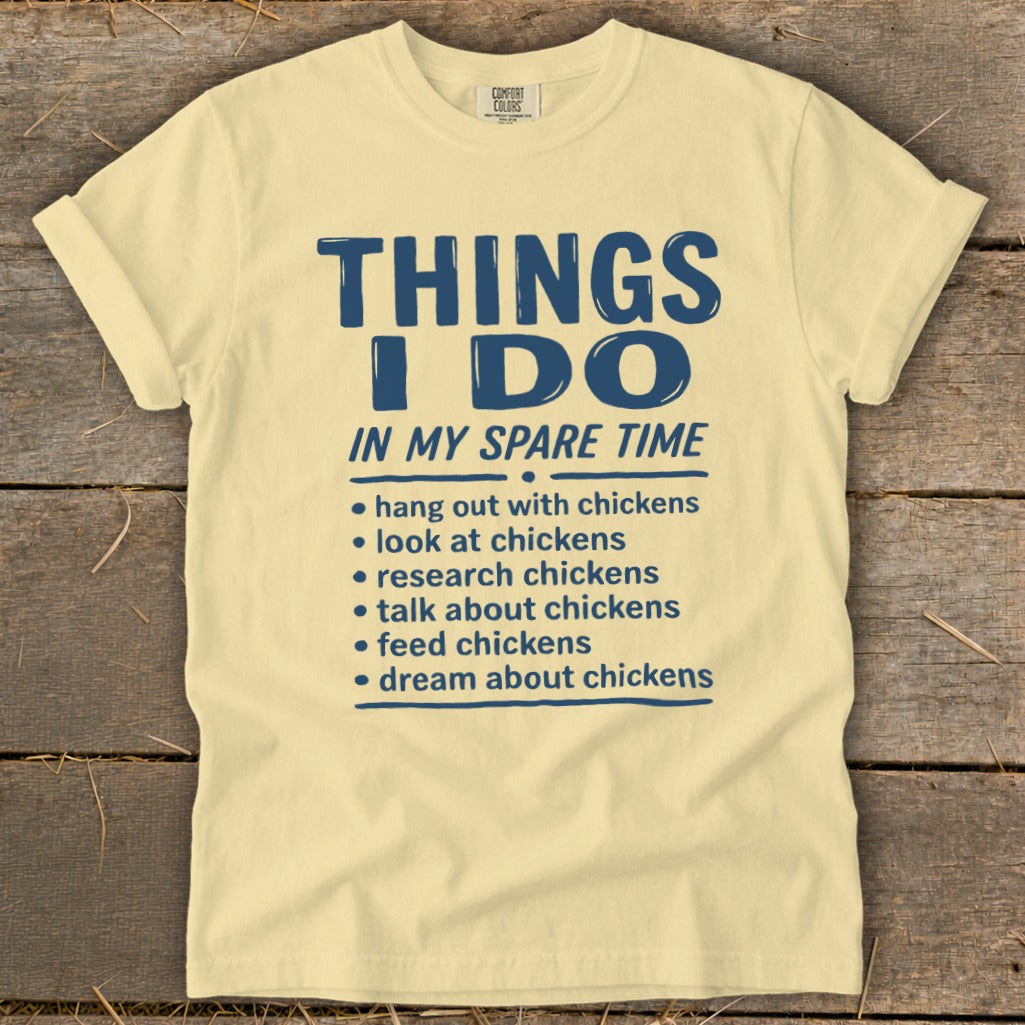 Yellow t-shirt with blue text listing chicken-related activities.