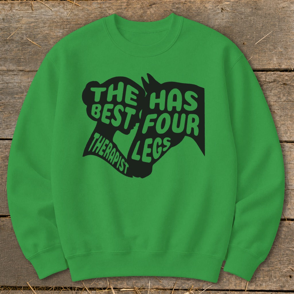 Green crewneck sweatshirt with black text and horse head graphic reading "The best therapist has four legs."