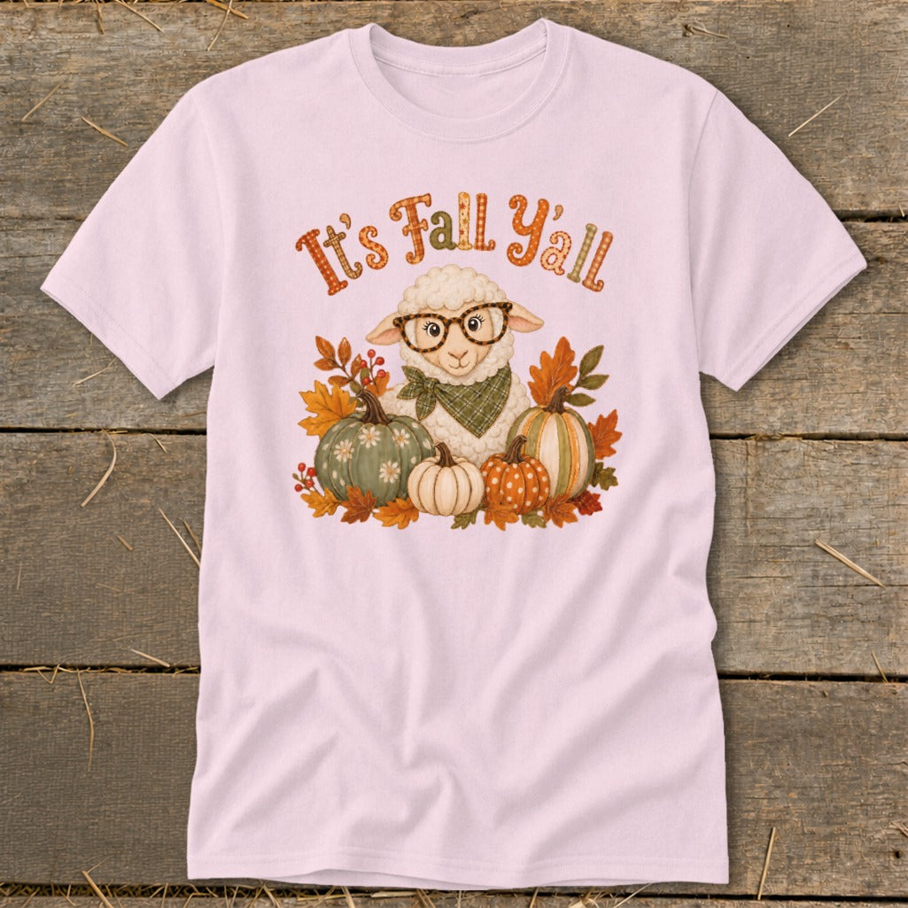 Pink t-shirt with a cartoon sheep wearing glasses and a bandana surrounded by pumpkins and autumn leaves, text reads "It's Fall Y'all".