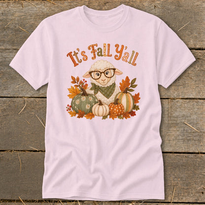 Pink t-shirt with a cartoon sheep wearing glasses and a bandana surrounded by pumpkins and autumn leaves, text reads "It's Fall Y'all".