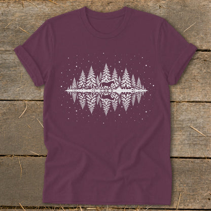 Maroon t-shirt with white graphic of horse in snowy pine forest reflected in water.