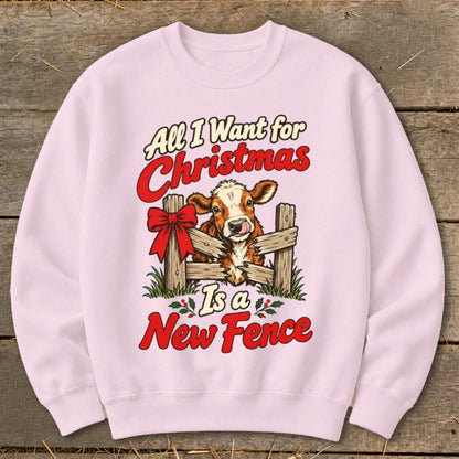 Pink sweatshirt with cow graphic and text: "All I Want for Christmas Is a New Fence".