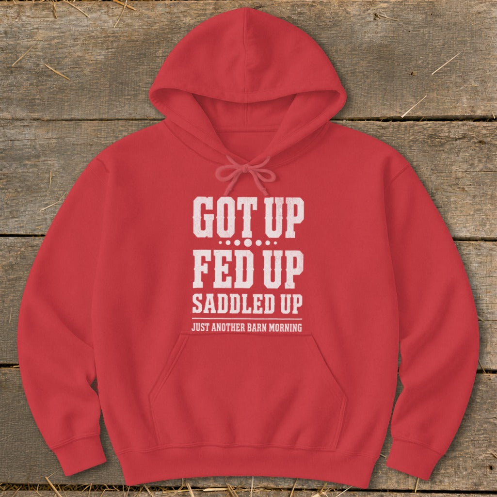 Red hoodie with white text "GOT UP FED UP SADDLED UP JUST ANOTHER BARN MORNING".