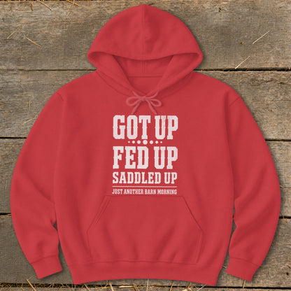 Red hoodie with white text "GOT UP FED UP SADDLED UP JUST ANOTHER BARN MORNING".