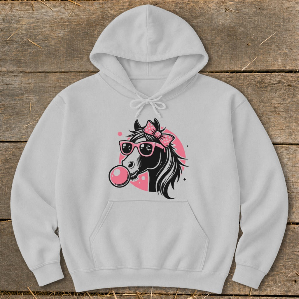 White hoodie featuring a black horse with pink sunglasses and bow blowing bubble gum.