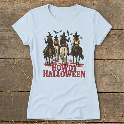 Four witches on horseback in silhouette, with "Howdy Halloween" text below.