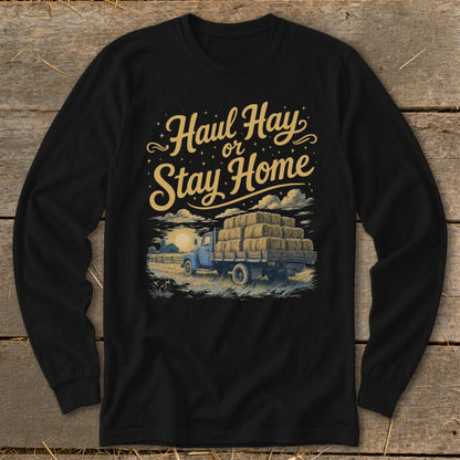 Black long-sleeve shirt with "Haul Hay or Stay Home" text above a truck loaded with hay bales.