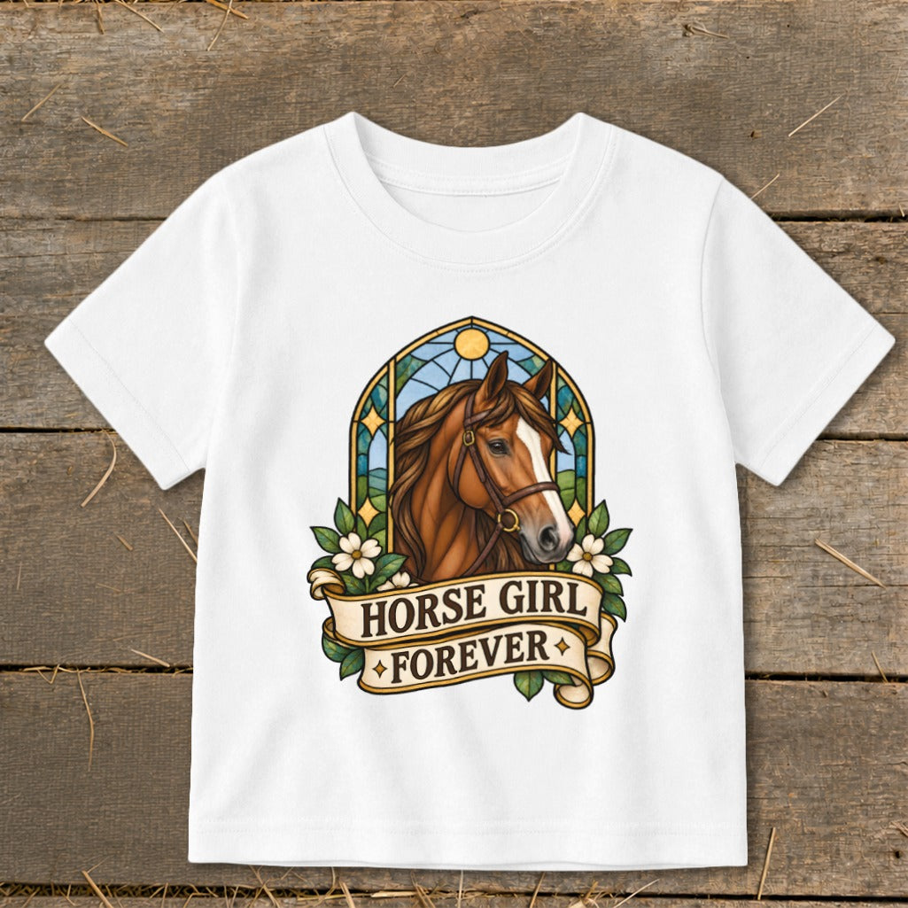 White t-shirt with a brown horse head, stained glass arch, and "Horse Girl Forever" banner.