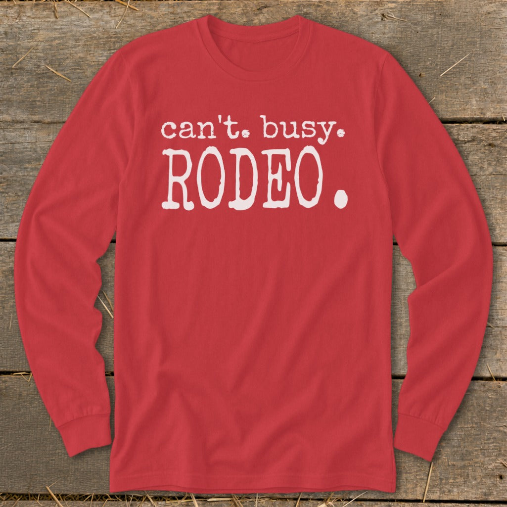 Red long sleeve shirt with white text that reads "can't. busy. RODEO."