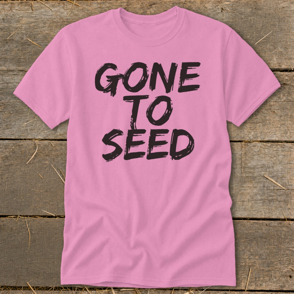 Pink t-shirt with black text that reads "GONE TO SEED".