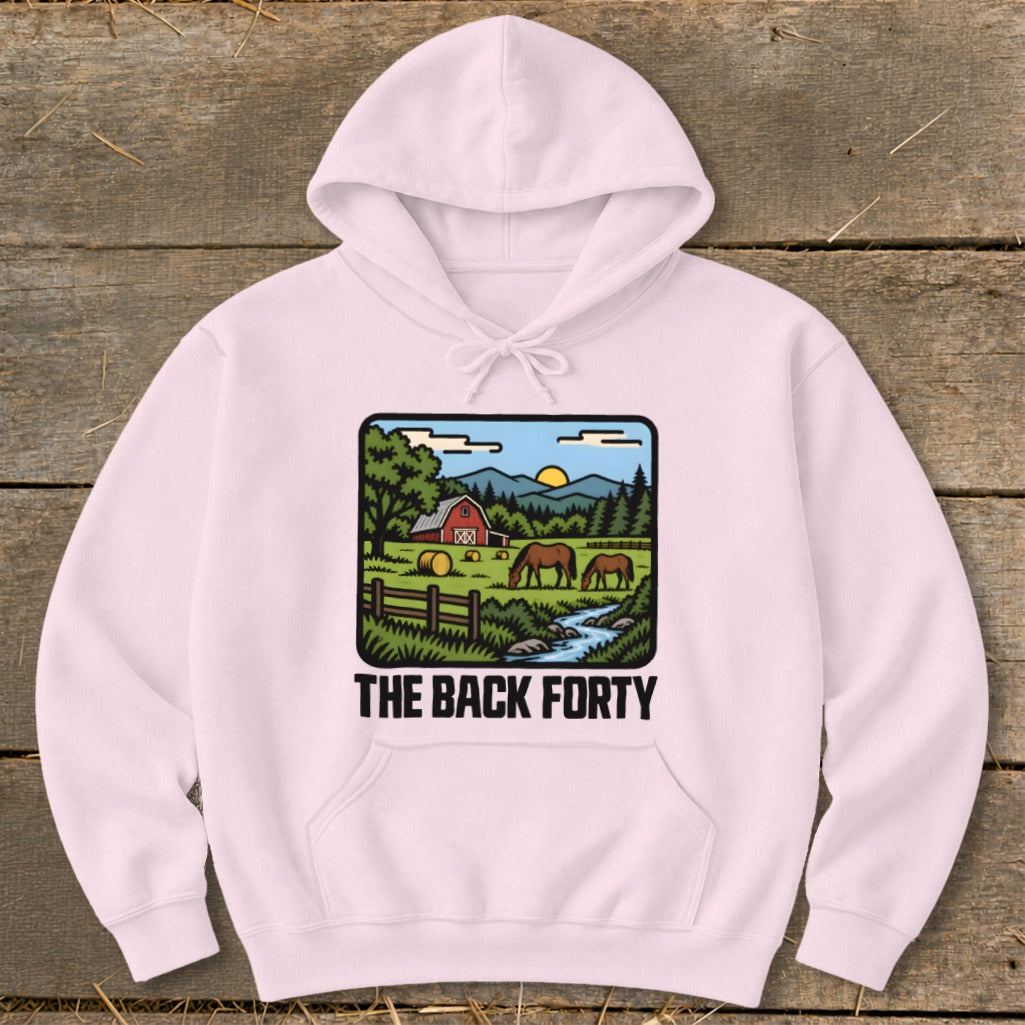 A light pink hooded sweatshirt with a graphic of a farm landscape and the text THE BACK FORTY.
