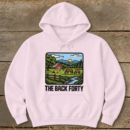 A light pink hooded sweatshirt with a graphic of a farm landscape and the text THE BACK FORTY.