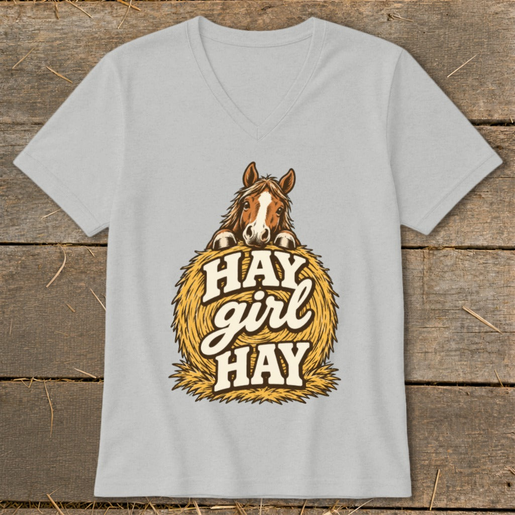 Horse peeking over hay bale with text "HAY girl HAY" on light gray t-shirt.