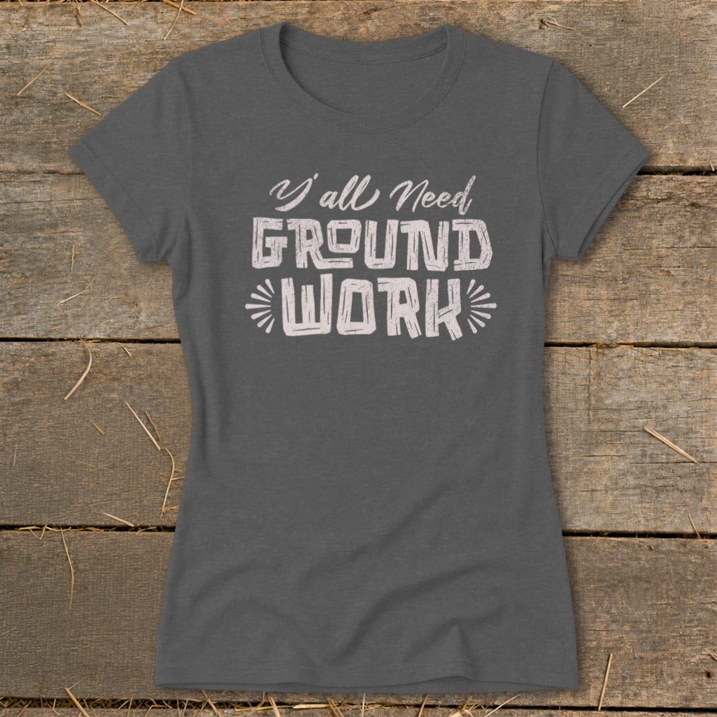 Dark grey t-shirt with "Y'all Need GROUND WORK" printed in white.