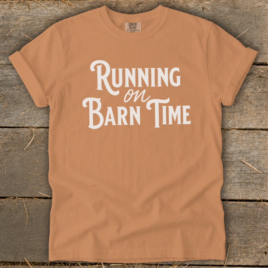 Orange t-shirt with white text "Running on Barn Time"