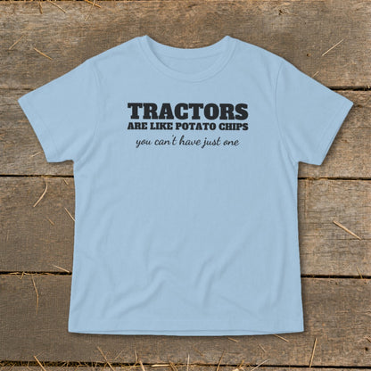 Light blue t-shirt with "Tractors are like potato chips you can't have just one" text.
