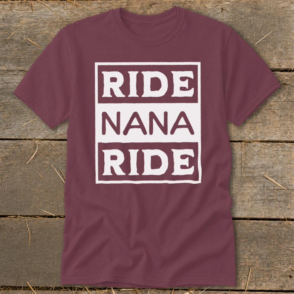 Maroon t-shirt with white text "RIDE NANA RIDE" in a framed box.