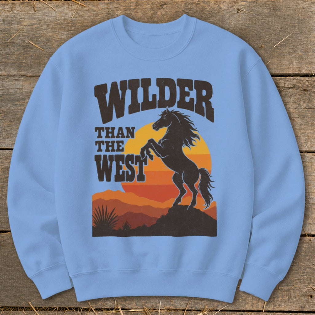 Light blue sweatshirt with "Wilder Than The West" text and a rearing horse.
