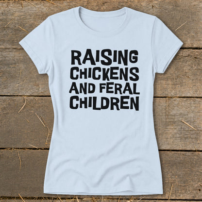 Light blue t-shirt with black text reading "Raising Chickens and Feral Children".