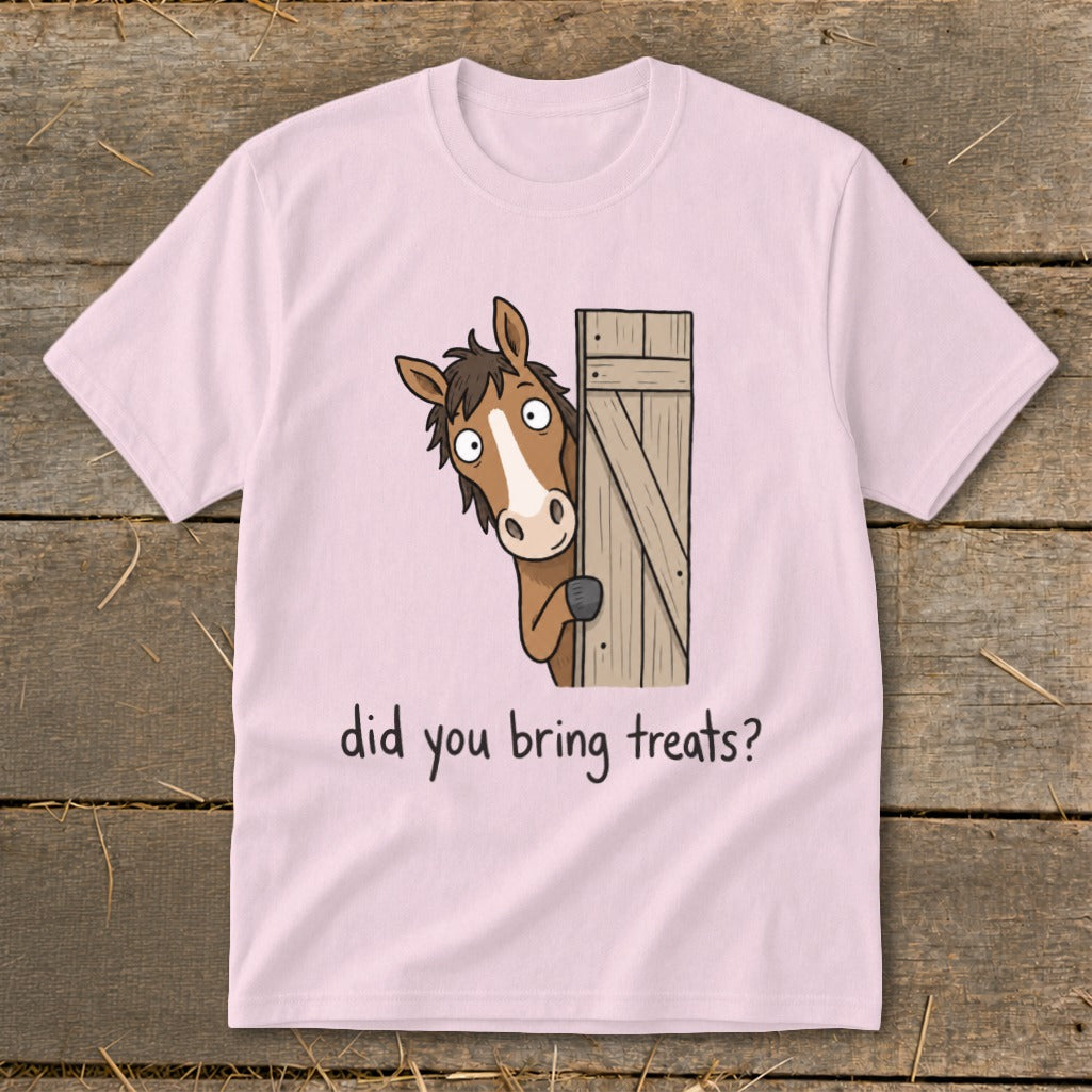 Pink t-shirt with cartoon horse peeking around a wooden gate, asking "did you bring treats?".