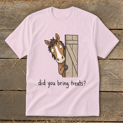 Pink t-shirt with cartoon horse peeking around a wooden gate, asking "did you bring treats?".