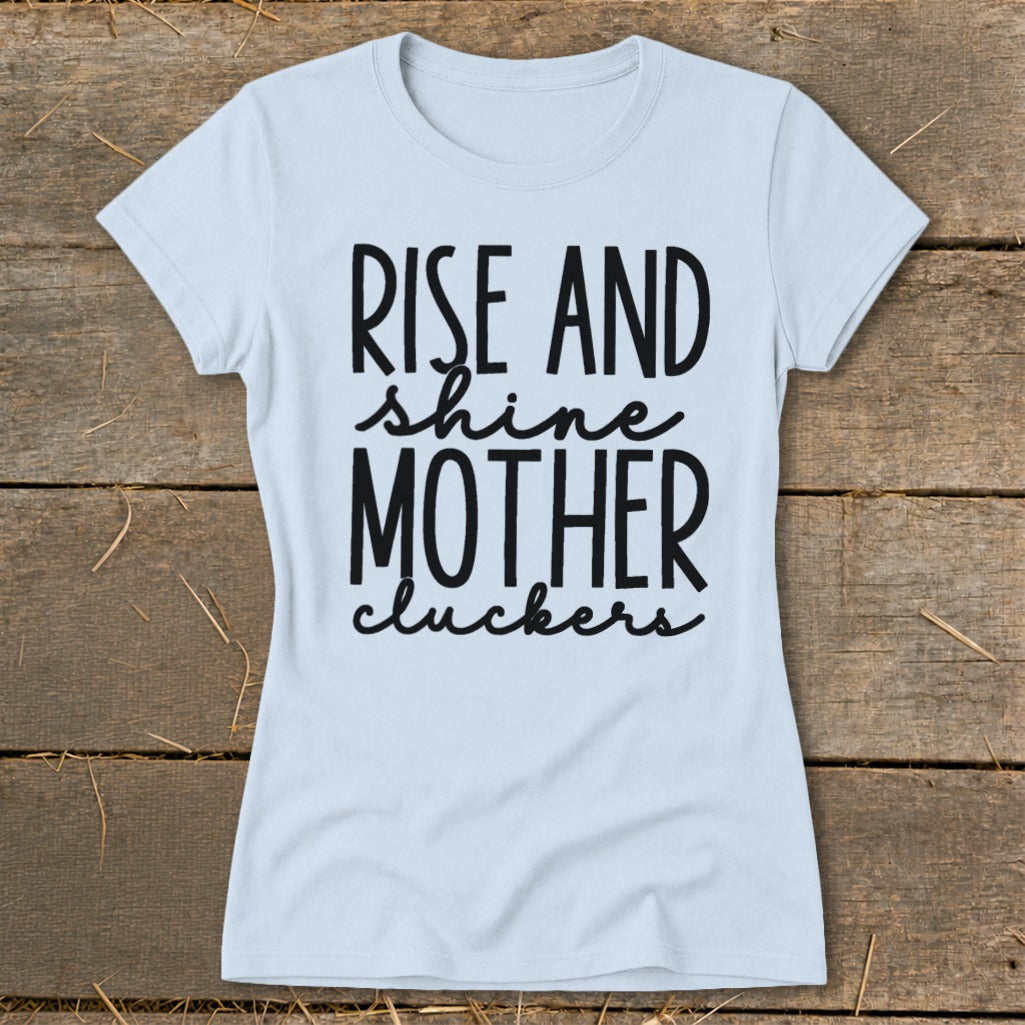 Light blue t-shirt with black text that reads "RISE AND shine MOTHER cluckers".